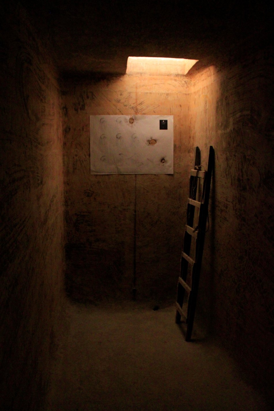 A Dark Wine Cellar Illuminated by the Hole on the Ceiling